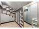 Walk-in closet with custom shelving units and a mirrored door at 209 Eucalyptus Ln, Mesquite, NV 89027