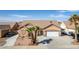 A charming single-story home featuring desert landscaping, a two-car garage and a well-maintained front yard at 209 Eucalyptus Ln, Mesquite, NV 89027