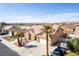 Single-story home with desert landscaping, tile roof, three-car garage, and driveway with desert views at 209 Eucalyptus Ln, Mesquite, NV 89027
