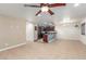 An open-concept living room features tile floors with views to the kitchen bar at 209 Eucalyptus Ln, Mesquite, NV 89027