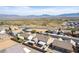 An aerial view showcasing a residential neighborhood with mountain views in the distance at 209 Eucalyptus Ln, Mesquite, NV 89027