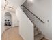 Carpeted stairs with wooden handrail lead to the next level in this home at 209 Eucalyptus Ln, Mesquite, NV 89027