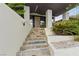 Stylish multi-colored stone steps leading to the entrance door, enhanced by lush greenery at 214 S Maryland Pkwy, Las Vegas, NV 89101
