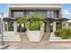 Striking two-story multi-Gathering home featuring a unique entrance and covered balconies on both levels at 214 S Maryland Pkwy, Las Vegas, NV 89101