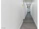 Hallway with gray flooring and fresh paint, connecting different areas of the home with a clean and modern aesthetic at 214 S Maryland Pkwy, Las Vegas, NV 89101