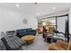 Modern living room with stylish furniture and a large window providing natural light at 214 S Maryland Pkwy, Las Vegas, NV 89101