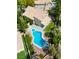 Aerial view showcasing backyard with pool, spa, manicured lawn, and lush landscaping at 2401 Rice Flower Cir, Las Vegas, NV 89134