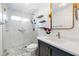 Modern bathroom with a glass-enclosed shower, floating shelves, and a stylish vanity at 2401 Rice Flower Cir, Las Vegas, NV 89134