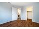 Bedroom featuring hardwood floors, an ensuite bathroom, and a closet at 2401 Rice Flower Cir, Las Vegas, NV 89134