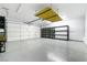 Spacious two car garage with shelving and epoxy flooring at 2401 Rice Flower Cir, Las Vegas, NV 89134