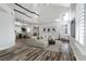 Bright and airy living room featuring vaulted ceilings, wood floors, and an open-concept layout at 2401 Rice Flower Cir, Las Vegas, NV 89134