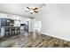 Open-concept living space flows into the kitchen with butcher block island and barstool seating at 2401 Rice Flower Cir, Las Vegas, NV 89134
