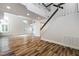 Open living area with staircase, vaulted ceilings, and lots of natural light from shuttered windows at 2401 Rice Flower Cir, Las Vegas, NV 89134