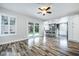Bright living area flows to kitchen, featuring sliding doors and backyard views at 2401 Rice Flower Cir, Las Vegas, NV 89134
