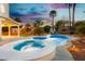 Relaxing pool with a spa and spacious backyard, perfect for entertaining guests and enjoying the outdoors at 2401 Rice Flower Cir, Las Vegas, NV 89134