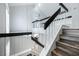 Staircase and second-floor landing overlooking the kitchen and living areas at 2401 Rice Flower Cir, Las Vegas, NV 89134