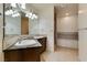 Spacious bathroom with dual sinks, granite counters, and separate tub/shower at 2405 W Serene Ave # 236, Las Vegas, NV 89123