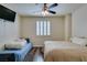 Bedroom with neutral walls, shuttered window, laminate flooring, and two bed options at 2405 W Serene Ave # 236, Las Vegas, NV 89123