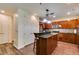Open-concept kitchen with a center island, stainless steel appliances, and ample storage space at 2405 W Serene Ave # 236, Las Vegas, NV 89123