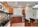 Bright kitchen with wood cabinets, stone countertops, stainless steel appliances, and ample counter space at 2405 W Serene Ave # 236, Las Vegas, NV 89123