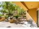 Charming patio features mature landscaping and comfortable seating area at 2405 W Serene Ave # 236, Las Vegas, NV 89123