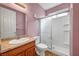 Bathroom featuring a shower with glass door and neutral color walls at 2435 Paddock Ln, Las Vegas, NV 89156