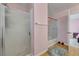 Shower over tub, tile floors and light pink walls at 2435 Paddock Ln, Las Vegas, NV 89156