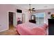 Bedroom featuring a TV, ceiling fan, walk-in closet and beautiful views at 2435 Paddock Ln, Las Vegas, NV 89156