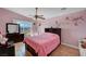 Bedroom with a ceiling fan, sliding glass door, and mountain views at 2435 Paddock Ln, Las Vegas, NV 89156