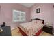 Cozy bedroom with a large window and neutral color walls at 2435 Paddock Ln, Las Vegas, NV 89156