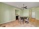Bright dining room with tile flooring, a modern ceiling fan, and a cozy fireplace at 2435 Paddock Ln, Las Vegas, NV 89156