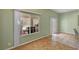 Neutral dining area with a large window and door leading to the backyard at 2435 Paddock Ln, Las Vegas, NV 89156