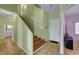 Home entryway featuring tile floors, a staircase, and doorway to the laundry room at 2435 Paddock Ln, Las Vegas, NV 89156