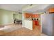 Eat-in kitchen showcasing a breakfast bar, wood cabinetry, and stainless steel appliances at 2435 Paddock Ln, Las Vegas, NV 89156
