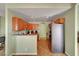 Bright eat-in kitchen featuring wood cabinets and stainless steel appliances at 2435 Paddock Ln, Las Vegas, NV 89156