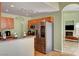 An eat-in kitchen with stainless steel appliances and views into the living spaces at 2435 Paddock Ln, Las Vegas, NV 89156