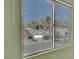 Window view of neighborhood, houses, street and mountains at 2435 Paddock Ln, Las Vegas, NV 89156
