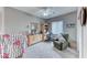 This bedroom features a ceiling fan and a work desk at 2561 Cosmic Dust St, Henderson, NV 89044