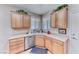 Kitchen area showcases stainless steel appliances and ample wooden cabinet storage at 2561 Cosmic Dust St, Henderson, NV 89044