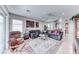 Open concept living room featuring tile floors, lots of natural light and comfortable furniture at 2561 Cosmic Dust St, Henderson, NV 89044