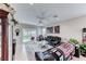Bright living room featuring tile floors, neutral paint, comfortable furniture and a ceiling fan at 2561 Cosmic Dust St, Henderson, NV 89044