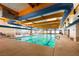 Bright community indoor pool area with swim lanes and lounge seating at 2561 Cosmic Dust St, Henderson, NV 89044