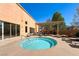 Inviting pool area with a round pool, lounge chairs, and shaded pergola at 2561 Cosmic Dust St, Henderson, NV 89044