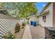 Cozy backyard area with decorative fence, gravel landscaping, and mature rose bushes at 2706 Colanthe Ave, Las Vegas, NV 89102