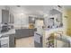 Well-equipped kitchen with gray cabinets, modern appliances, and a functional layout for culinary endeavors at 2706 Colanthe Ave, Las Vegas, NV 89102