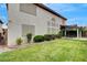 Exterior shot of the back of the house, covered back patio, and green backyard at 2727 Warm Rays Ave, Henderson, NV 89052