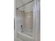 Bright bathroom featuring a tub with shower, a tile surround, and modern fixtures at 2727 Warm Rays Ave, Henderson, NV 89052