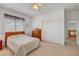Bedroom with natural light, a large closet, and an en-suite bathroom at 2727 Warm Rays Ave, Henderson, NV 89052