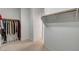 Spacious walk-in closet with ample storage solutions, and neutral carpeting at 2727 Warm Rays Ave, Henderson, NV 89052