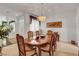 Elegant dining room featuring a classic wood table with six chairs and plenty of natural light at 2727 Warm Rays Ave, Henderson, NV 89052